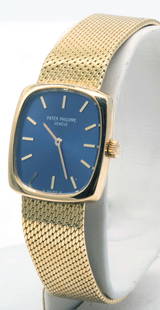 18k Gold Patek Philippe Ladies Watch Blue Dial: 18k Gold Patek Philippe Ellipse Oval Shaped Ladies Watch with Blue Dial. With rare rounded square case. Mesh band marked 750. In original back velvet lined box with white outer case (Daim written on