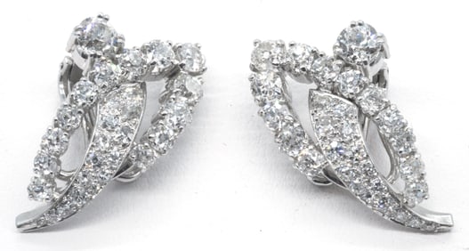 14k White Gold & Diamond Clip Earrings. Each with appx 1/4ct diamond surrounded