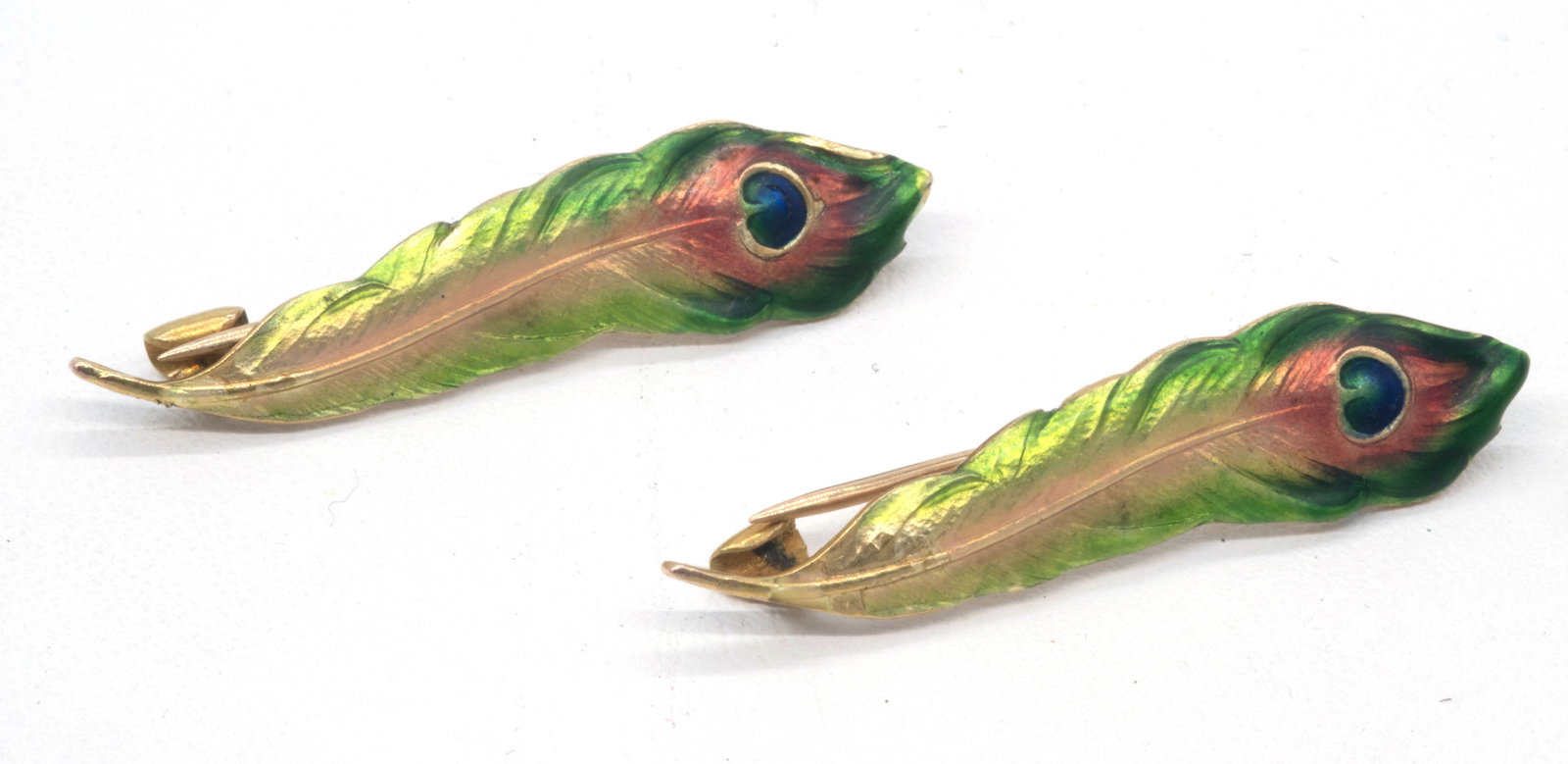 Pair of 14k Yellow Gold and Enamel Peacock Feather Pins: Pair of 14k Yellow Gold and Enamel Peacock Feather Pins. Measures appx 1 1/4" long. Weighs appx 4.2 grams.