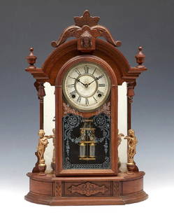 Waterbury walnut mantel clock with figures: Waterbury walnut mantel clock with mirrored sides and figures. Original stencil to glass front. Measures appx 23" t. Running.