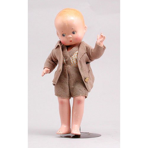 Effanbee "Skippy Doll".: DOLL. Composition Effanbee "Skippy" doll. 13 3/4" tall. Has some crazing and minor paint flaking, otherwise in good condition.