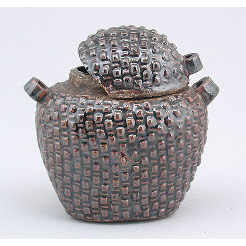 14th-15th C. Chinese Covered Jar: JAR. Chinese dark-brown glazed covered jar; cover and body decorated with basket-weave design, and both have two loop handles. 14th-15th C. Height with cover about 4 1/2". Cover broken into a number o