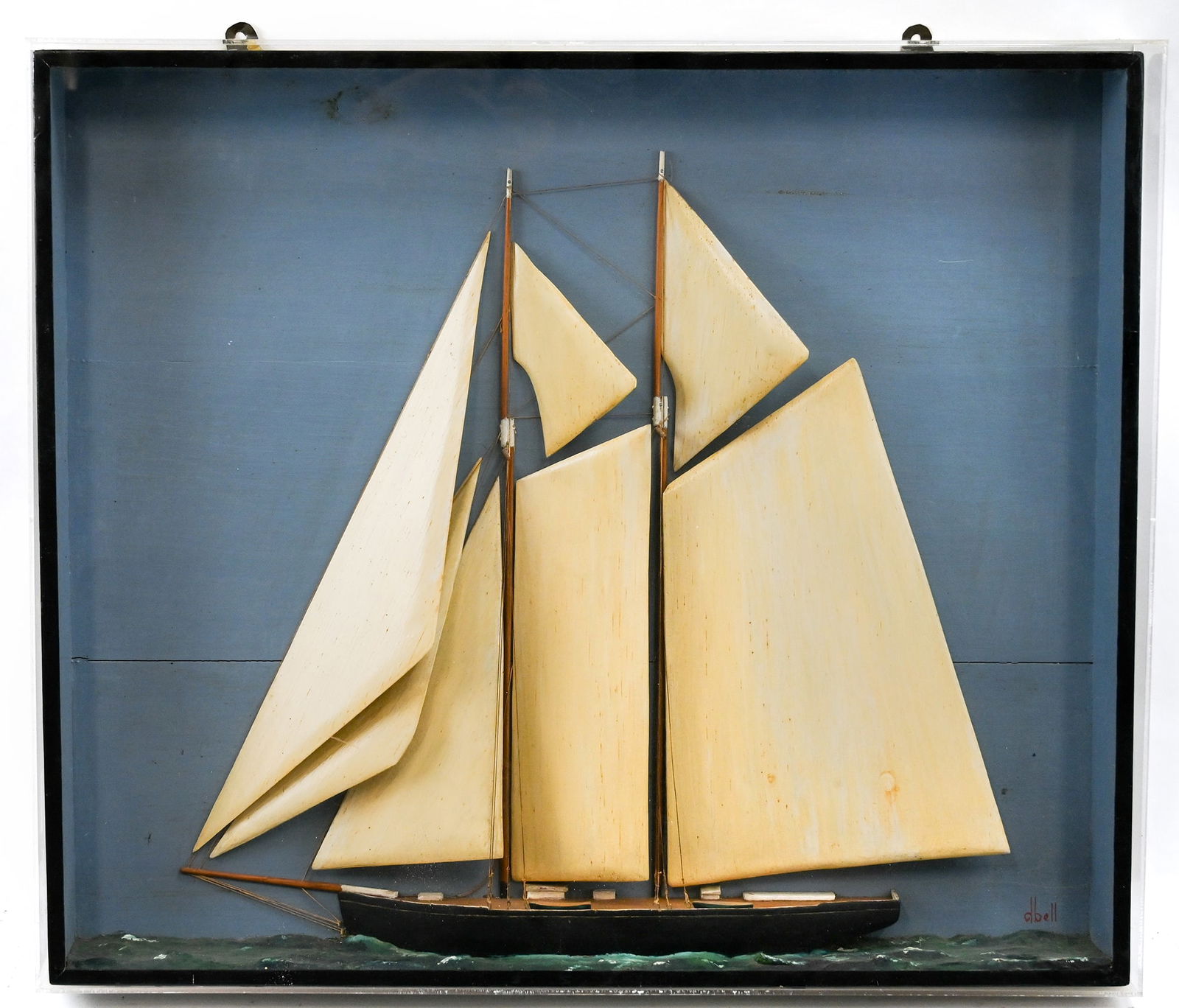 Hand Carved Wood Diorama Shadow Box Ship's Model: Hand Carved Wood Diorama Shadow Box Ship's Model. With removable plexiglass protective front cover. Hand carved wood sails with rigging. Fully painted background, ship, and sea. Signed lower right "db