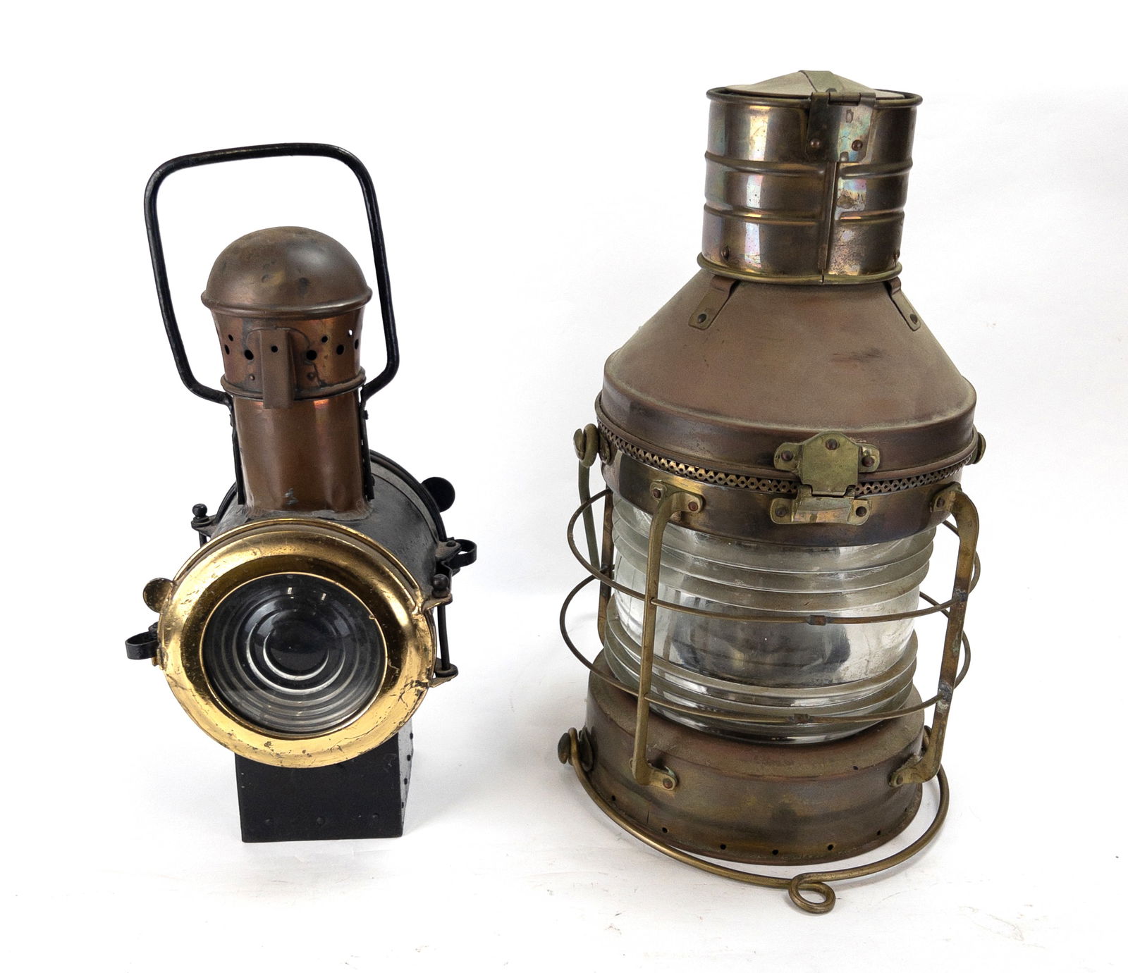 Pair of Clear Glass Ship's Oil Lanterns: Pair of Clear Glass Ship's Oil Lanterns. One by Emory & Douglas Co (Successor's to Morgan Weers) and one by Folligny. Largest measures 19 1/4" tall excluding handle x 11" across.