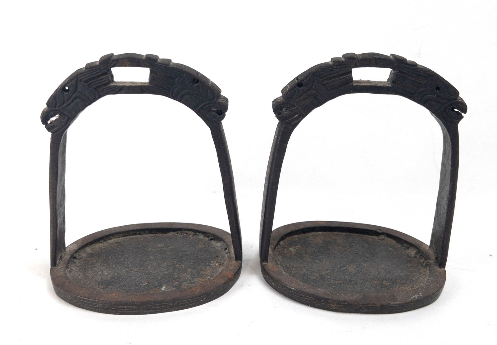 Pair of 19th C. Chinese Metal Stirrups Dragon Motif: Pair of 19th C. Chinese Metal Stirrups Dragon Motif. Remnants of gilt and oxidation from age. Measures appx 6" tall x 5" wide x 4 3/4" deep.