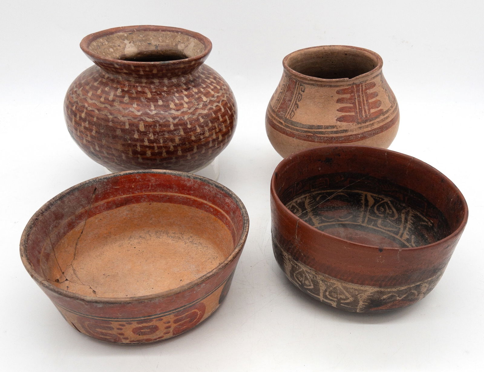 Lot of 4 Pre-Columbian Polychrome Pottery Bowls: Lot of 4 Pre-Columbian Polychrome Pottery Bowls. Wear to finish from age and use. Two with old restoration as shown. Largest measures appx 6 1/2" tall x 8" across.