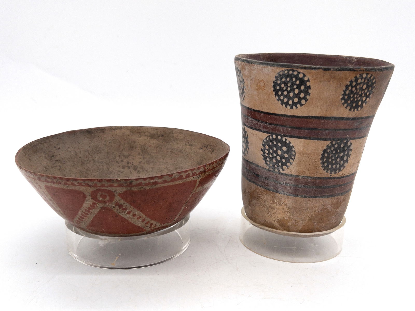 Lot of 2 Pre-Columbian Polychrome Pottery Bowls, Nayarit & Peru: Lot of 2 Pre-Columbian Polychrome Pottery Bowls, Nayarit & Peru. Old crack to tallest, measures appx 5 3/4" tall x 4 5/8" across. Smaller measures appx 2 5/8" tall x 6 1/2" across.