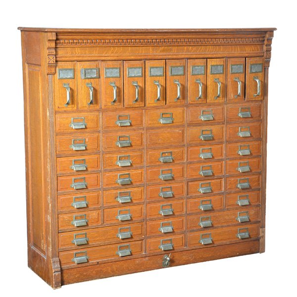 American Multi Drawer Cabinet, Early 20th C: American Multi Drawer Cabinet, Early 20th C, oak, with nicely carved frieze over multiple file drawers, and lock and key, 37 1/2" x 27n 1/2", good original condition.