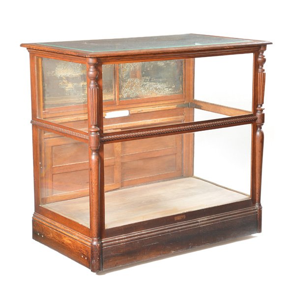 American Store Display Case, Early 20th C: American Store Display Case, Early 20th C, oak with beveled glazed top, two shelves and sliding upper and lower door panels, 45"h x 47"l x 28 1/2"w, very fine period condition.