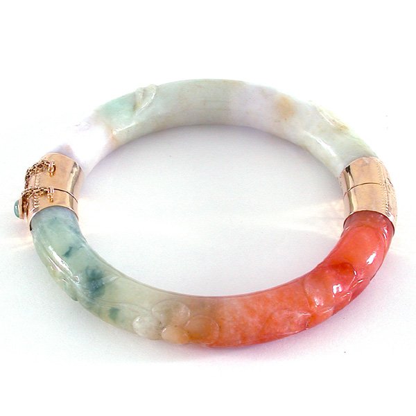 Multi-Colored Jade Bracelet with 14 Karat Yellow Gold: Hinged, multi-color carved jade bangle bracelet with engraved 14 karat yellow gold hinge, clasp, and safety chain.
