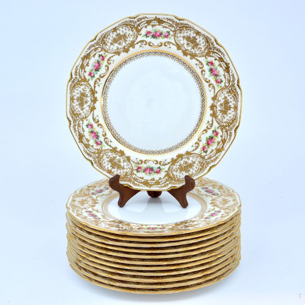 Set of 12 Royal Doulton China Plates, 10 3/8": Set of 12 Royal Doulton China Plates, 10 3/8", scalloped gold rim and border design, and floral clusters inset on rim, encircling a cream colored center, maker's mark and seller at bottom, J B Hudson 
