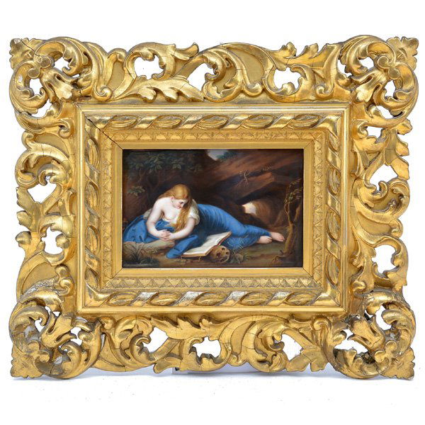 Framed KPM Porcelain Plaque: Framed KPM Porcelain Plaque, depicting penitent Magdalena, draped and reclining, resting on her arms while reading a book amid a rocky natural landscape, with paper retailer's label for Ernst Arnold,