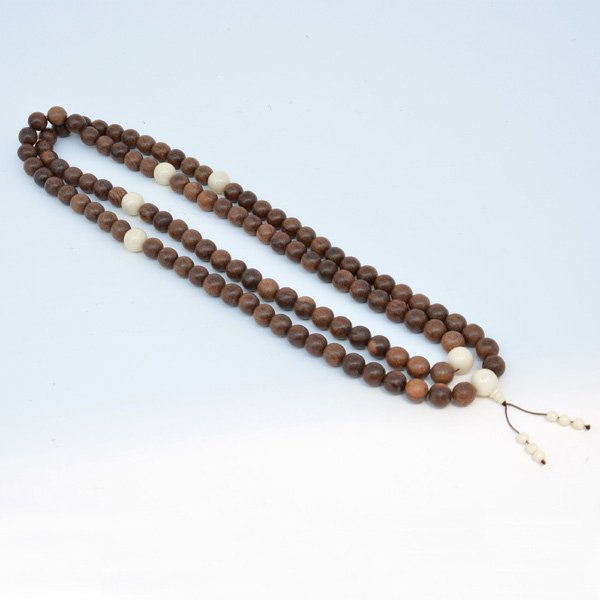 Chinese Chenxiang Buddhist Prayer Beads: Chinese Chenxiang Buddhist Prayer Beads, 108 round chenxiang beads each 0.65" diameter, interspaced with five larger ivory beads, 66"l.
