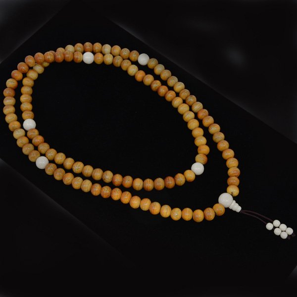 Chinese Tiger Bone Buddhist Prayer Beads: Chinese Tiger Bone Buddhist Prayer Beads, string of 108 round tiger bone beads interspaced with larger ivory beads, 41"l.