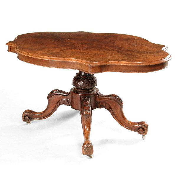 Victorian Turtle Top Table: Victorian Turtle Top Table, 19th c American, bookmatched burl walnut turtle top over ornately carved scrolling feet, 28"h x 56"w x 43"d, good condition.