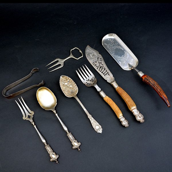 Lot of Assorted Silverplate Serving Utensils: Lot of Assorted Silverplate Serving Utensils to include: Mappin & Webb fork and knife with bone handles, knife and spoon with ornate handles, spoon with fruit repousse, a crumber with bone handle, orn