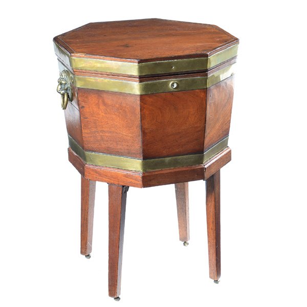 English Wine Cellarette, Early 19th C: English Wine Cellarette, Early 19th C, mahogany, of octagonal shape with lift top and brass banding, brass lion head handles, supported by four square tapered legs, 29" h x 18" w x 17 1/4" d, good con