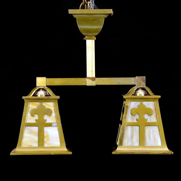 Arts and Crafts Brass 2 Light Ceiling Fixture: Arts and Crafts brass 2 light ceiling fixture with carmel glass decorated with fleur de lis, 15 1/2" h x 17" w x 6 1/2" d, good condition. From the Estate of Janet Collier San Rafael, California.