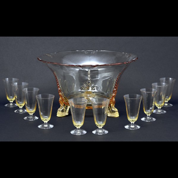 Punch Bowl & Glass Set: Punch bowl & glass set, soft gold colored glass bowl with scalloped edge on shaped tripod base and (10) slender tulip shaped glasses, 8 3/4" h x 15" dia.(bowl), 4 1/2" h (glasses), good condition.