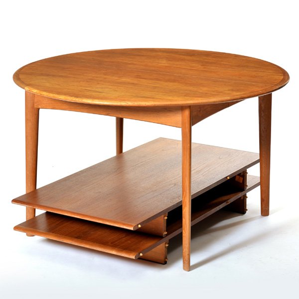 Danish Modern Svend A. Madsen Teak Dining Table: Danish Modern Svend A. Madsen teak round dining table with (2) 24" skirted leaves, eased edged top and recessed skirt on tapered elliptical legs, stamped at bottom "Made in Denmark", 28 1/2" h x 48" d