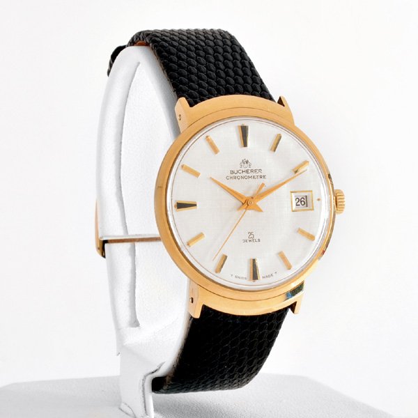 18 Karat Gold Bucherer Chronometer Watch: 18k yellow gold Bucherer Chronometer / Date wrist watch on lizard strap, twenty-five jewels, very good condition.