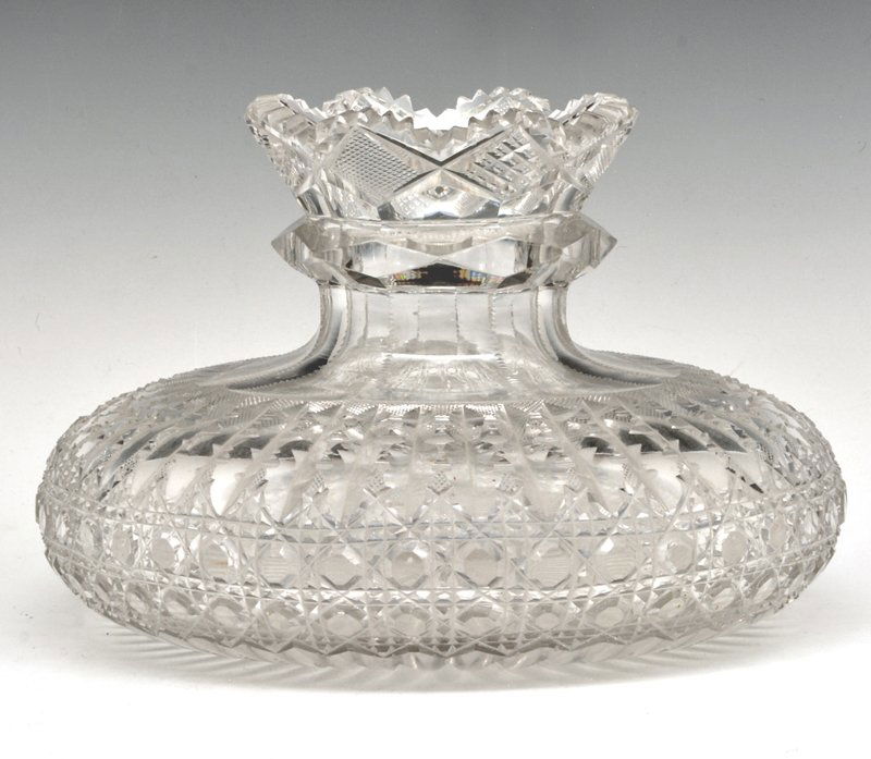 American cut glass low bowl carafe: American cut glass low bowl carafe with narrow neck and flared rim, 6 1/2" h x 10" d. Very good condition with very minor flea bites in the center of the wheel cut bottom.