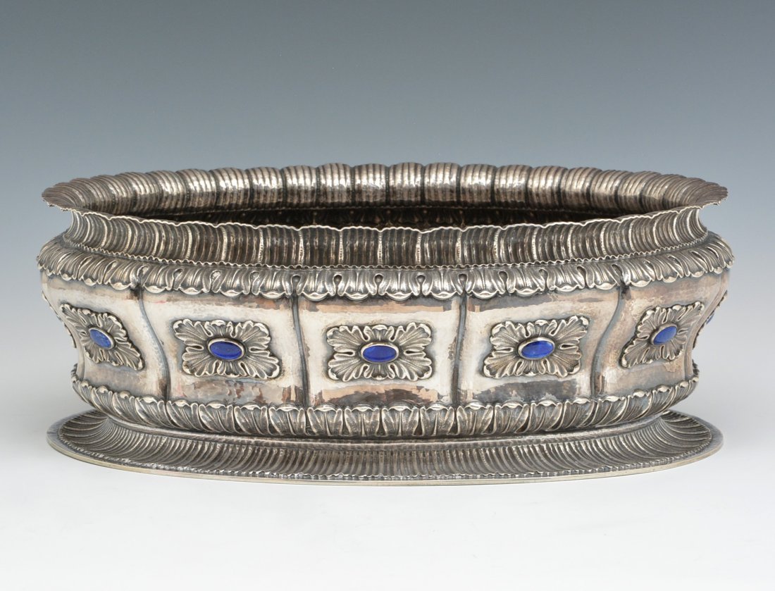 Italian Silver & Lapis Centerpiece Bowl, Buccellati: Italian Silver and Lapis Centerpiece Bowl with Buccellati Mark, 20th c. The oval body chased with foliate cartouches inset with lapis bosses and chased acanthus borders, marked under base. 5 5/8" h x