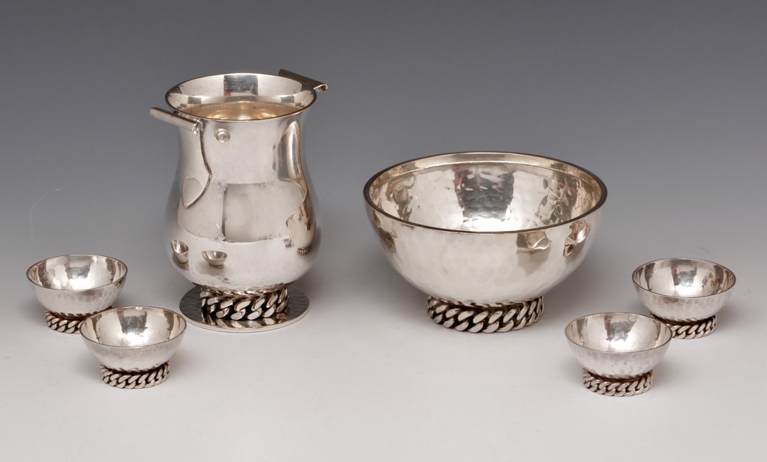 Jean Despres Art Deco Silverplate ensemble: Jean Despres Art Deco Silverplate ensemble, including a handled vase (4 1/8" tall), and a bowl (4 3/8" diameter) with 4 matching cups. Inscribed signature on the 2 larger pieces along with hallmarks a