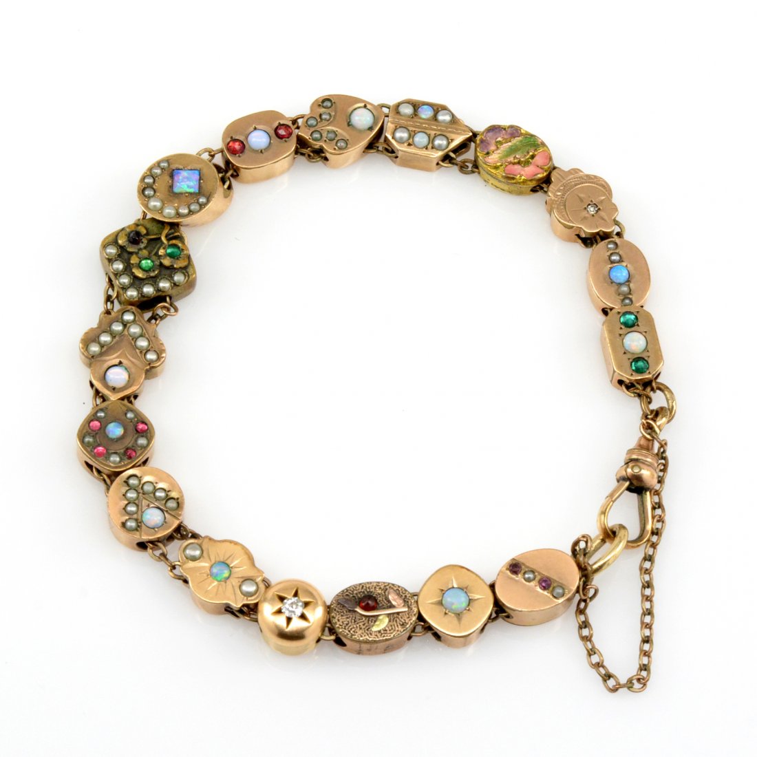 Vintage Gemstone Slide Bracelet: Vintage gemstone slide bracelet including diamonds, pearls, opals, garnets, emeralds and more, finished with a safety chain.
