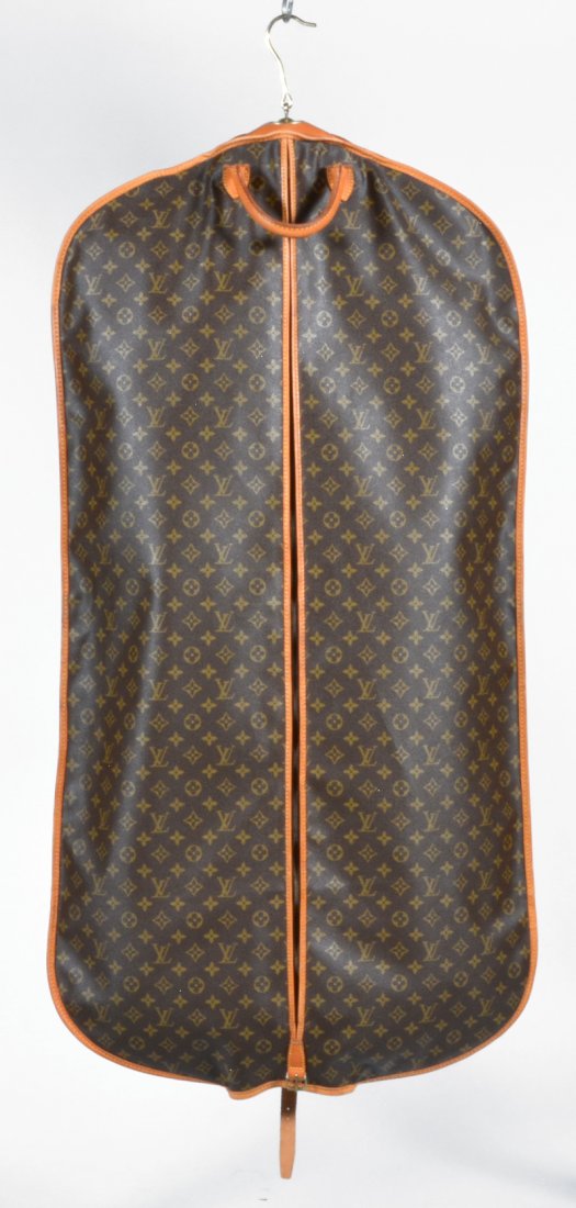 Louis Vuitton Garment Bag: Louis Vuitton garment bag, with luggage tag and strap to adjust to half size, zipper opening in front, separate shoe compartment at back, brass hook, 46", very good condition.
