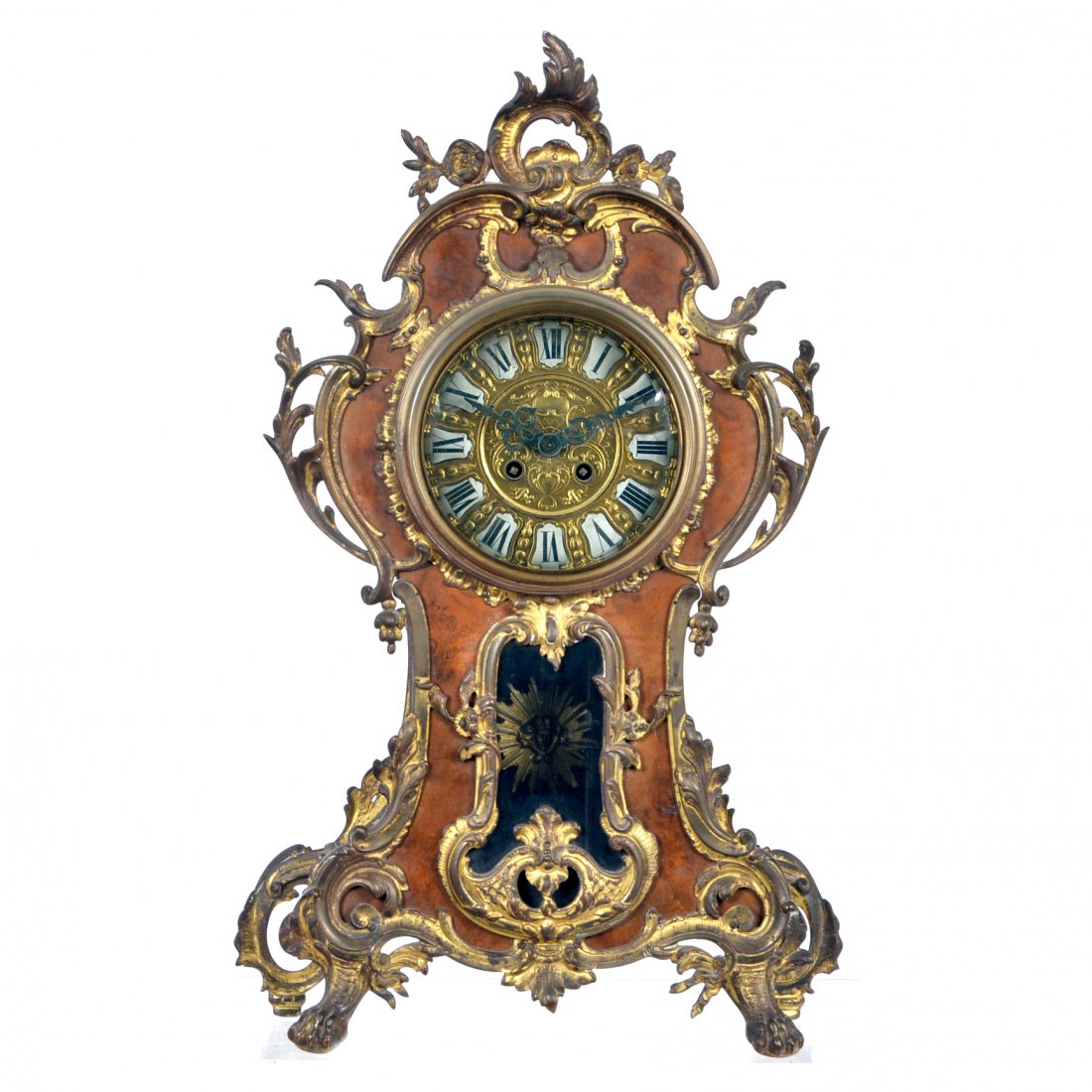 French ormolu & walnut mantle clock, sunburst pendulum: French ormolu mounted walnut mantle clock with sunburst pendulum and fancy brass embossed dial. 21.75" tall. Working.