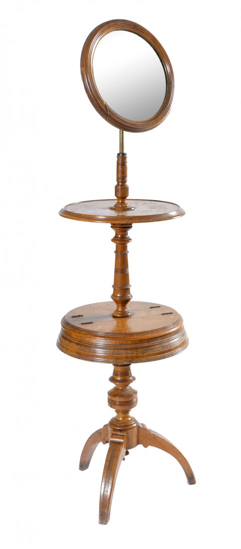 English shaving stand, 19th c: English shaving stand, 19th c, with adjustable mirror, central shelf, lower compartmentalized lift top bin, all on turned column ending on a tripod base. 63+" t x 19"d. Good condition with typical wea