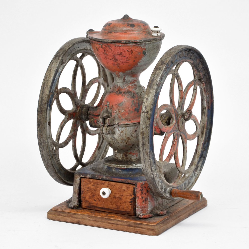 Enterprise Coffee Grinder: Enterprise Coffee Grinder, made by the Enterprise Mfg. Co., Philadelphia, a counter top coffee grinder, working, with some wear and paint loss. 15" tall, wheel diameter 11".