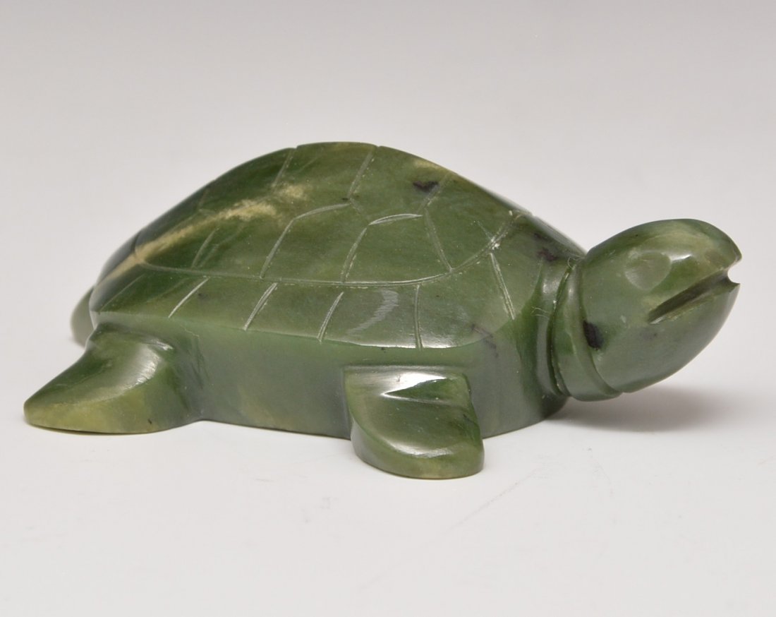 Jadeite turtle shape snuff bottle: Jadeite turtle shape snuff bottle. Turtle is 3 inches long and 1 inch high. Head is removable stopper. Republic. Purchased from Yuan Feng & Co. Ltd., Hong Kong, China 7/15/1970