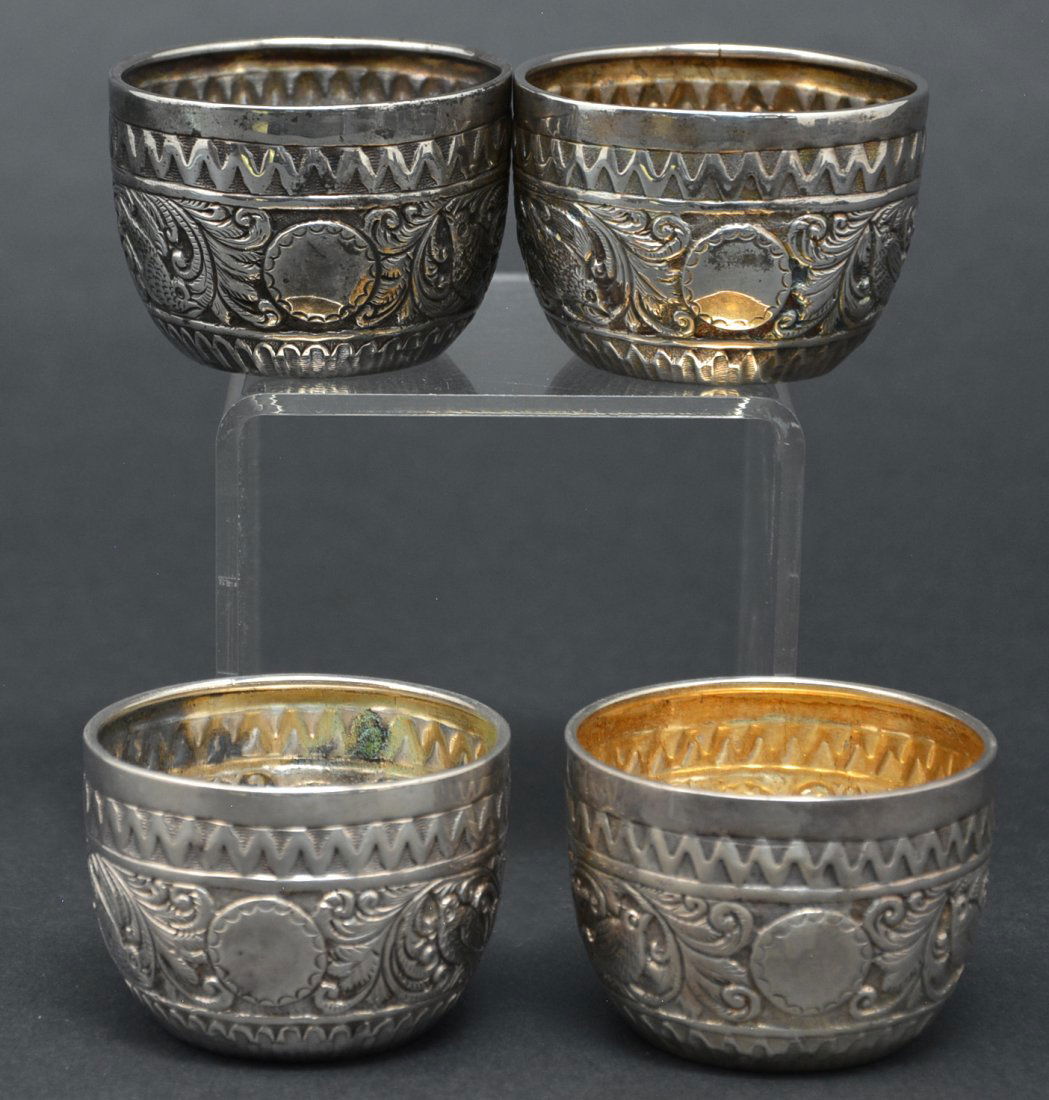 English Sterling Cups (4), Charles Stuart Harris, 1882: English Sterling Cups (4), Charles Stuart Harris, 1882 and 1885, bird and floral repousse, 2 1/8"d x 1 1/2"t, very good condition. 4.81 ozt.