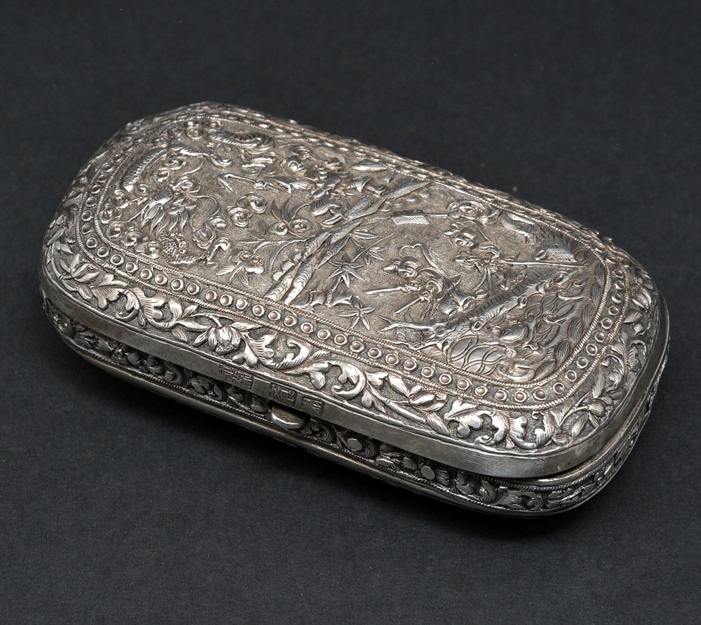 Chinese Silver Minaudiere, marks at front rim: Chinese Silver Minaudiere, marks at front rim, with hinged and clasp cover, chased and repousse with figures and animals in landscape, 4.5" long. 4.60 ozt