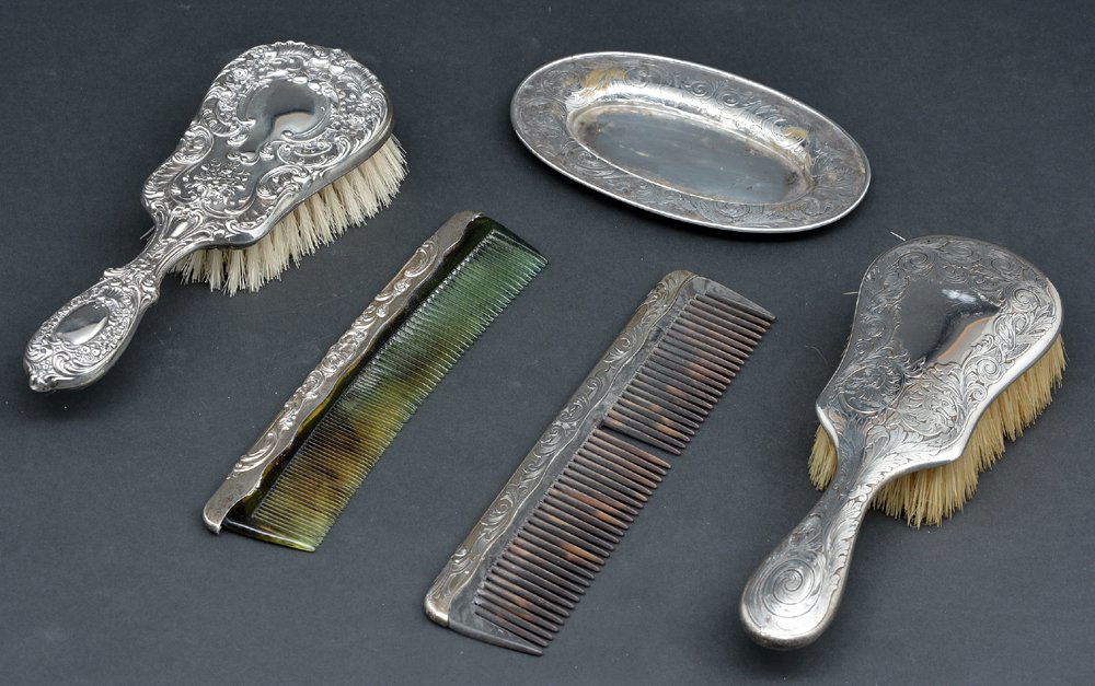 Lot of 2 pair sterling silver comb and brush sets, one: Lot of 2 pair sterling silver comb and brush sets, one with tray both Gorham. Brushes: 8 1/4"l, Combs: 7 1/2"l and 8"l, Tray: 6"l x 3 3/4"w. Good condition except one comb missing one tooth.