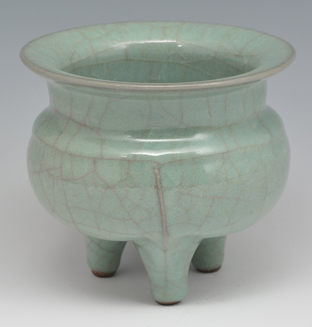 Longchuan tripod censer: Longchuan tripod censer, the compressed body with short upright neck and everted mouth rim, supported on three splayed legs each with raised rib extending to the shoulder, covered all over with a lumi