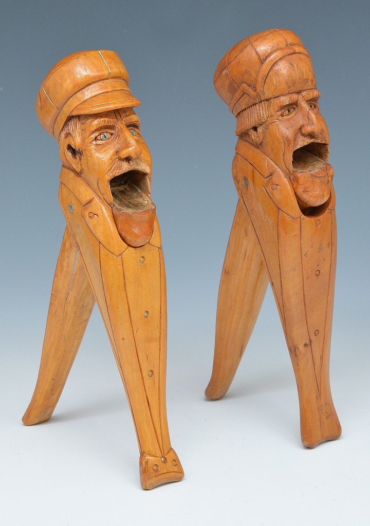 2 German Black Forest Carved Wood Nut Crackers: 2 German Black Forest carved wood nut crackers, for hazelnuts, with heads of seamen wearing caps. Largest appx 8". Good condition.