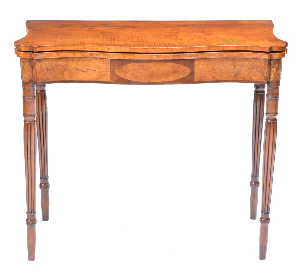 American Federal Curly Maple Games Table: American Federal inlaid curly maple shaped game table with medallion front and supported on fluted column legs. Appx 30"h x 34"w x 16 1/2"d, Open 30"h x 34"w x 33"d. Very good condition.