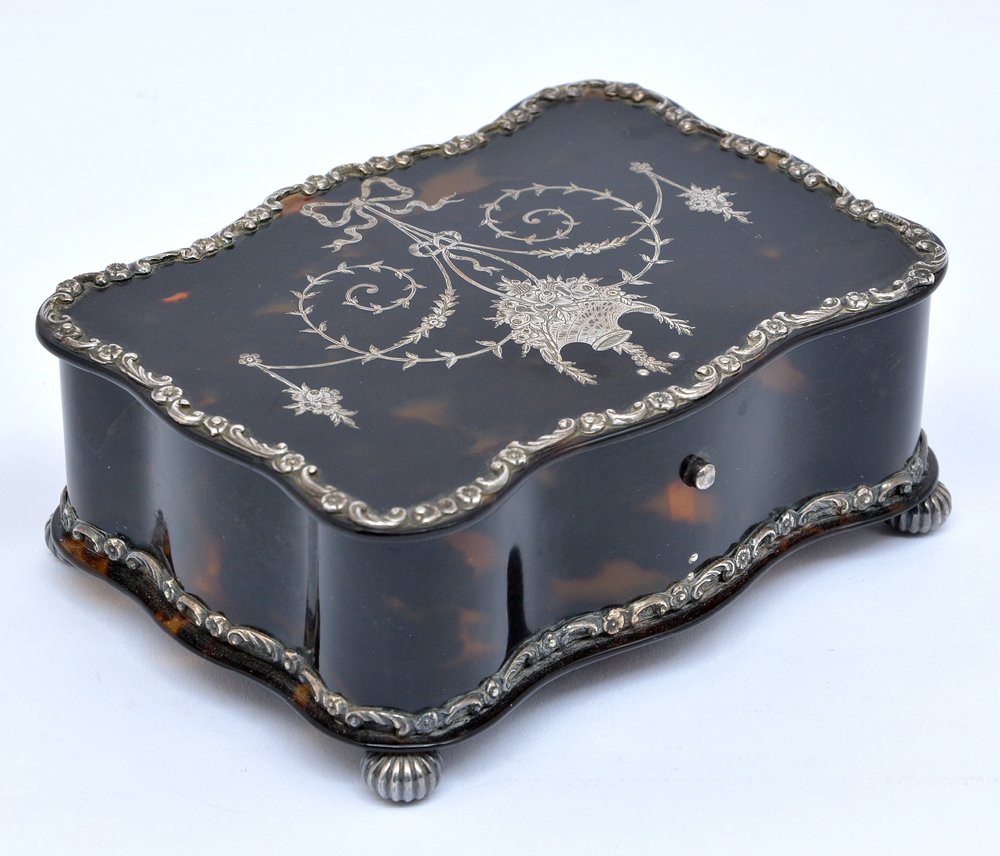 Lund Tortoiseshell & Silver Shaped Jewelry Box, c 1900: Lund tortoiseshell and silver shaped jewelry box with sterling inlaid top, banding and ball feet. Marked "Lund 57 Cornhill London" on bottom. c. 1900. Very good condition with no apparent damage. 2"h 