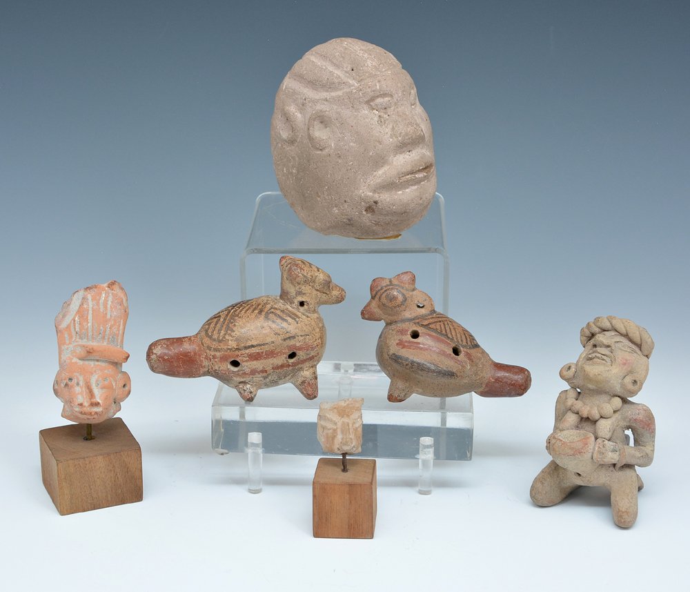 6 Pre Columbian Pottery And Stone Pieces: 6 Pre Columbian pieces featuring pottery humans and animals and a carved stone head with two faces. Largest appx 4"h.
