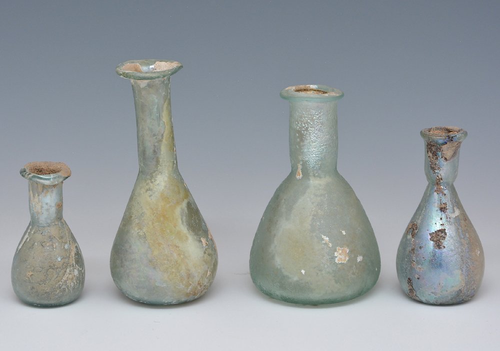 4 Roman Glass Tear Vials: 4 Roman glass tear vials, iridescent with some mineral encrustation. Largest appx 3"h.