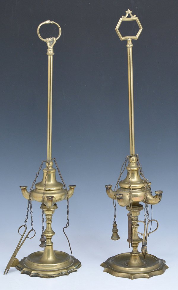 2 Brass whale oil lamps: 2 Brass whale oil lamps with spindle bodies and gadrooned bases: 1 with 4 lights, retains chatelaine with tweezers, snuffer, trimmer and cleaner, hex ring at top, appx 11 1/4"h; 1 with 3 lights, retai
