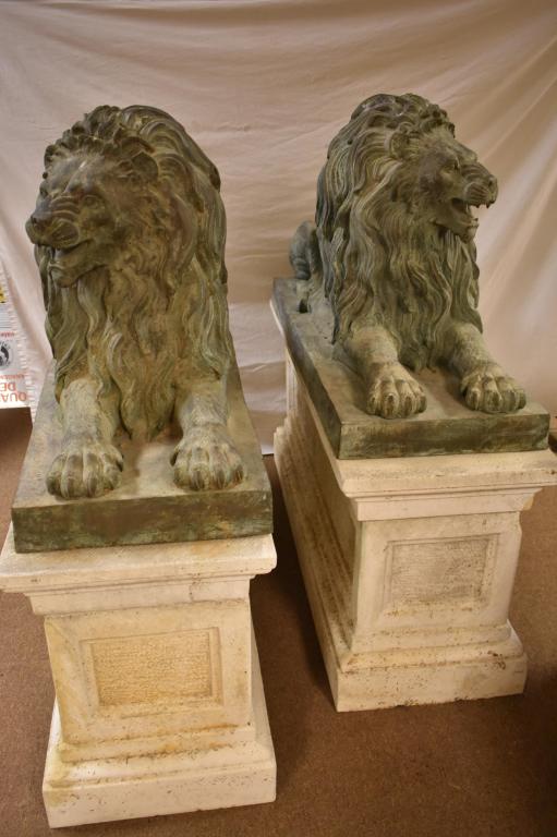 Mirrored Pair Life size Bronze Lions Signed Browns: Singed by Alex Browns. 20th century. On cast concrete pedestals. Lions are 28" x 49" x 18". Peds are 52" x 18" x 24". Local pick up only. Dr. Michael O'Banion Estate.