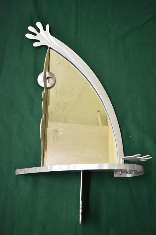 Aluminum Modern Abstract Art Body Mirror: Mirror frame is of a persons face, arm, hands and foot. 54" x 29" x 8 3/4". Local pickup or shipping outsourced.