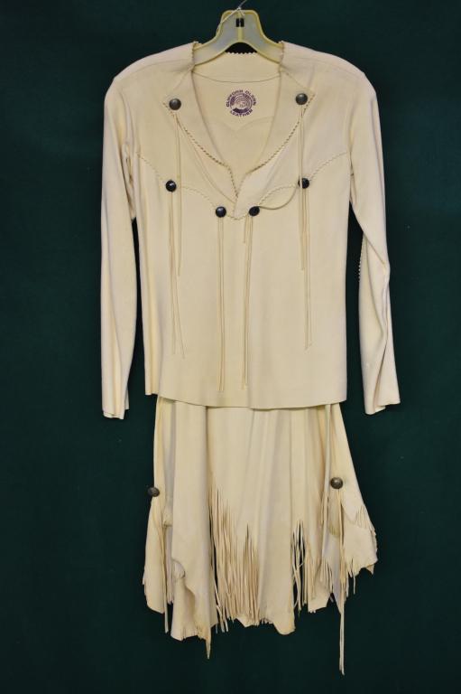 Designer Clifford Olson Leather Shirt and Skirt: Very nice soft leather. Shirt is decorated with fringe hanging form buttons. Skirt hem is uneven. Approximate size small.