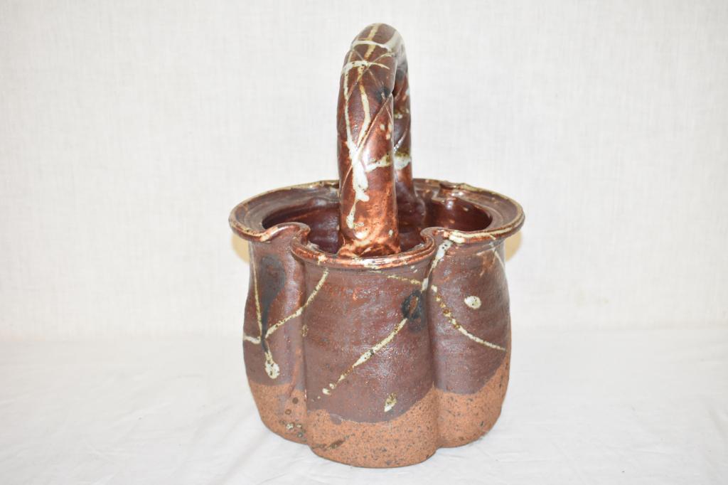 Bunny Mc Bride Large Pottery Basket: Well known Iowa City artist. Signed. 14 1/2" tall.