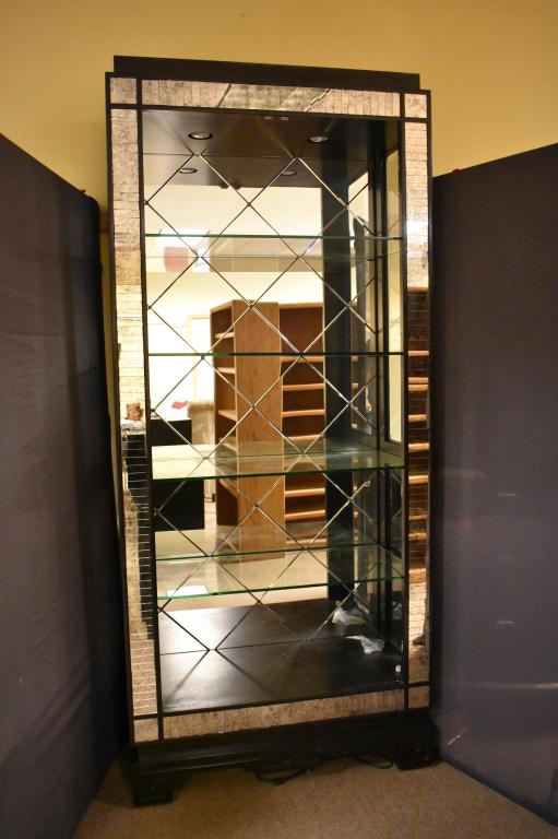 Marge Carson Glass & Mirrored Display Cabinet: Two glass door, 4 glass shelves lighted cabinet. Back is diamond shaped mirrors. Smoke veined mirror trim. Glass doors not shown but in good condition. One glass shelve has small chip. 91 1/2" tall x 