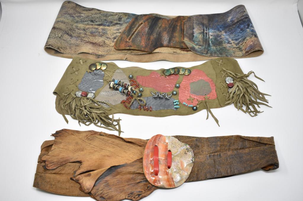 Three Leather & Suede Belts. Including Jane Yoo: Leather tie belt with shell buckle. Suede beaded belt. Jane Yoo wearable hand painted art leather belt.